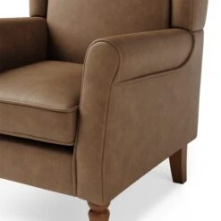 Oswald Distressed Faux Leather Wingback Armchair 15 Oswald Distressed Faux Leather Wingback Armchair -DUNELM Furniture Shop 30766646 alt06