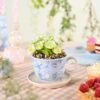 Artificial Flowers In Disney Alice In Wonderland Teacup Plant Pot -DUNELM Furniture Shop 30963287